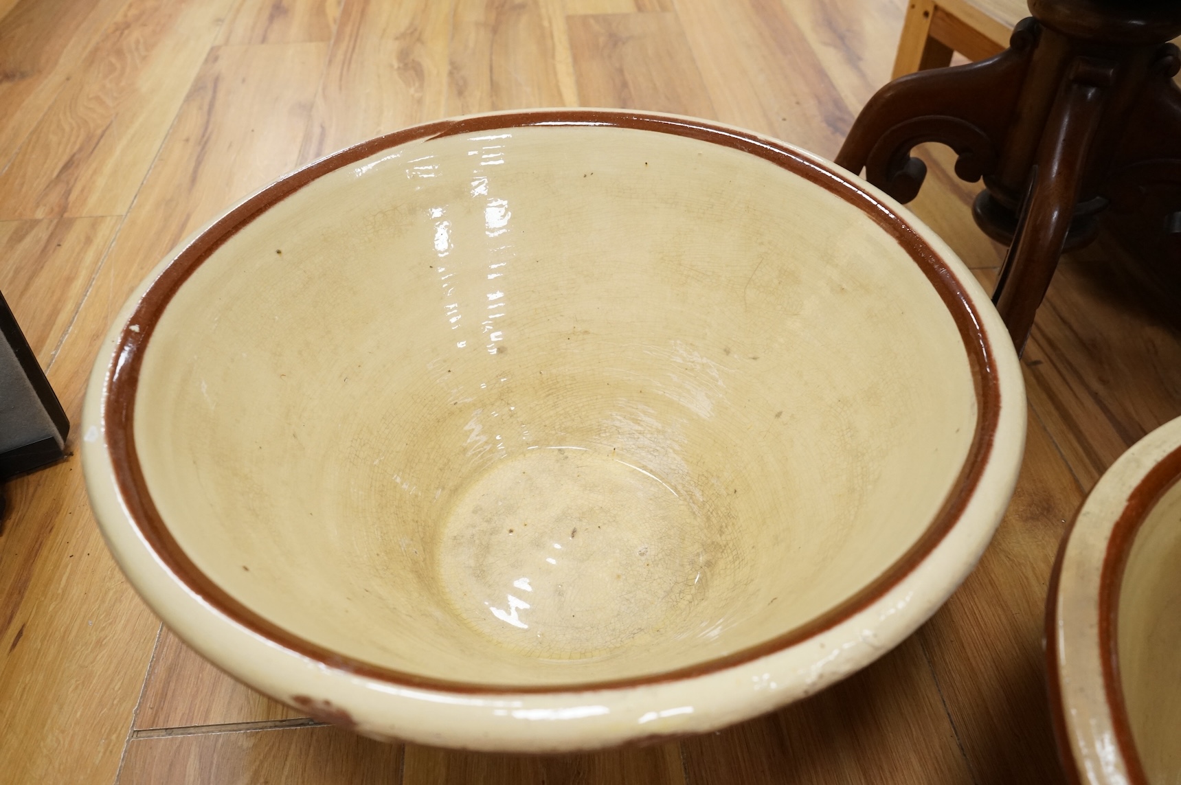 A pair of large slipware dairy bowls, 44cm diameter